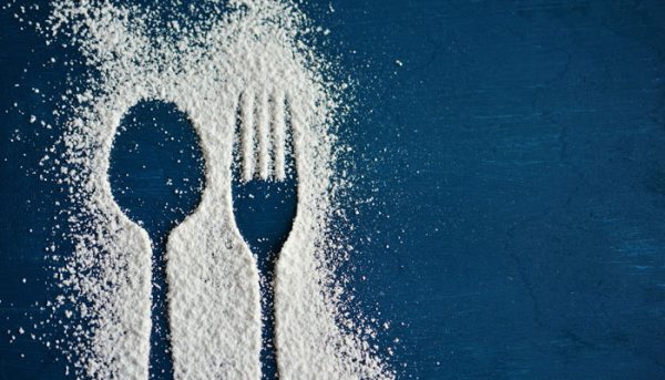 A fork and spoon outlined in sugar